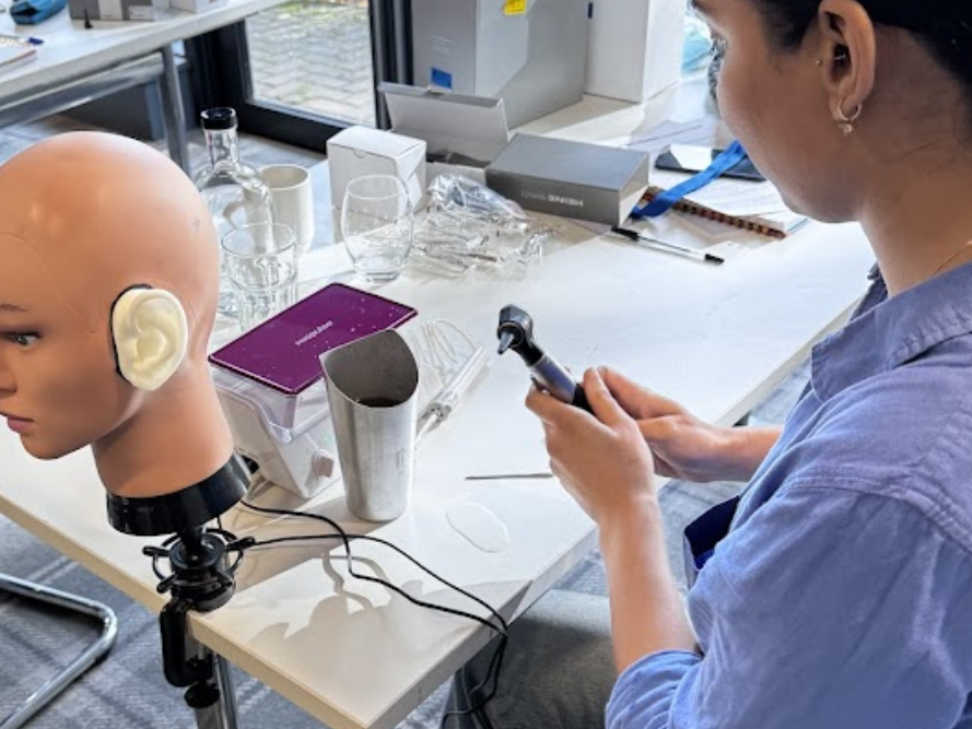 Otoscope examination during ear wax removal training
