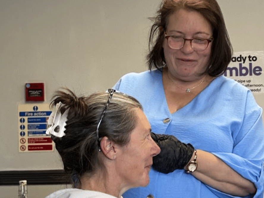 Close-up of ear examination on training course