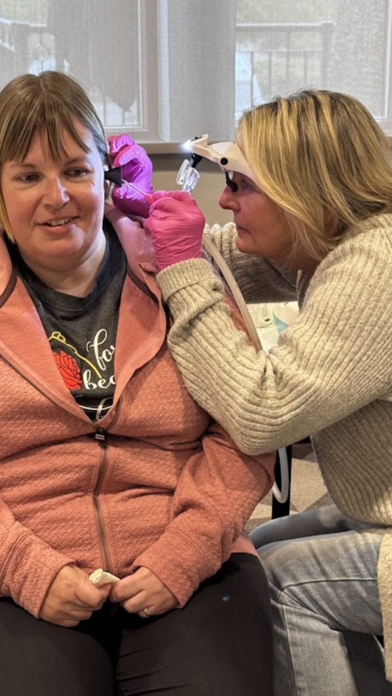 Trainee practising microsuction technique on training manikin